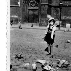 Rita feeding pigeons in Hanover