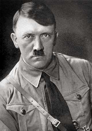 Black and white portrait photograph of Adolf Hitler in a Nazi party uniform.