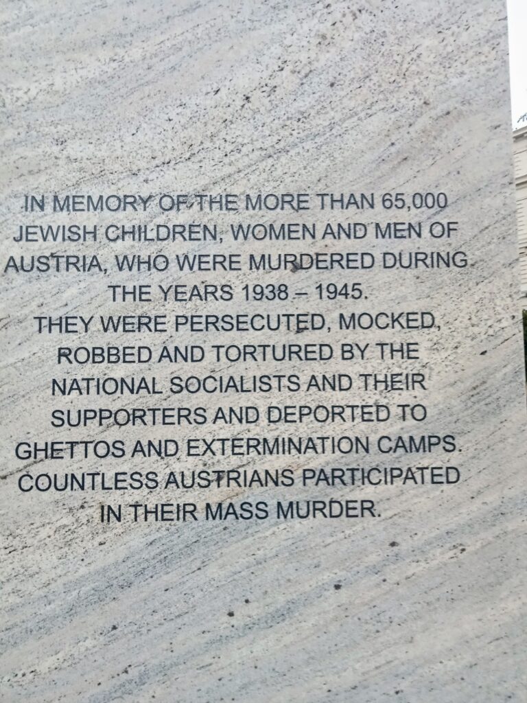 Stone memorial in Vienna inscribed in capitals: In memory of the more than 65,000 Jewish children, women and men of Austria who were murdered during the years 1938 to 1945.