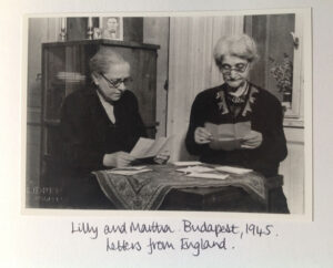 Lilly and Martha in Budapest in 1945 reading letters from England