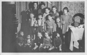 Scottish Refugee Centre, Sauchiehall St.Glasgow , taken  Chanukah/Xmas c 1944.
Ian Fulton Mid Row 2nd L (wearing braces) Fr.Row, 1st R is Edgar Prais KC ! (striped top).
