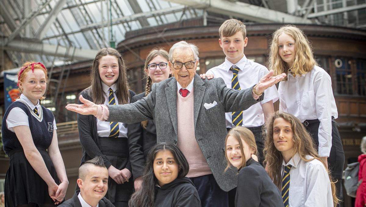Henry Wuga with school pupils from Shawlands Academy